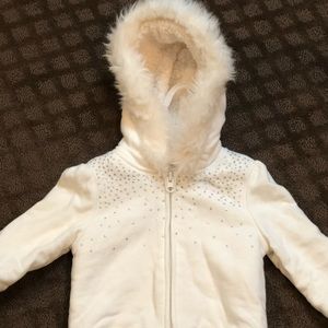 Cream fuzzy zip up sweatshirt.